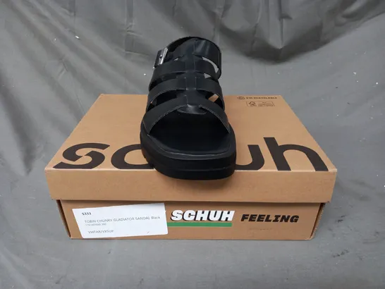 BOXED PAIR OF SCHUH TOBIN CHUNKY GLADIATOR SANDALS IN BLACK SIZE 6