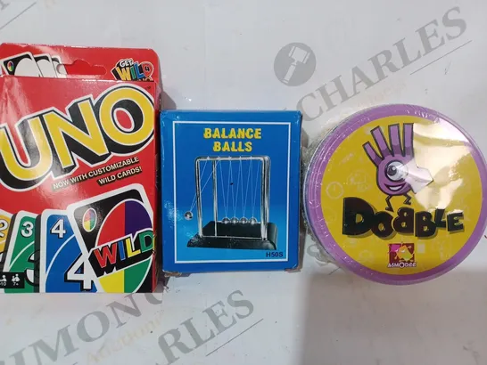 APPROXIMATELY 10 ASSORTED TOYS AND GAMES TO INCLUDE DOBBLE, BALANCE BALLS, UNO, ETC