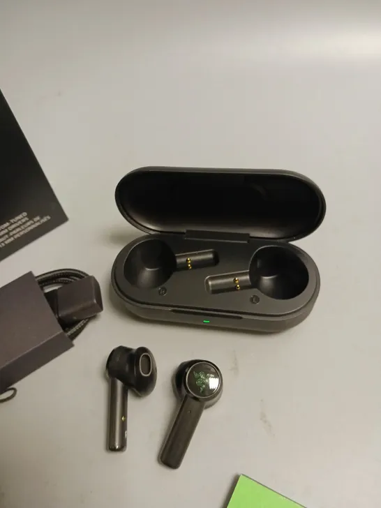 LOT OF 5 BOXED RAZER WIRELESS HEADPHONES IN BLACK AND GREEN INCLUDES CHARGING CASE, CABLE, WRIST STRAP AND SPARE BUDS