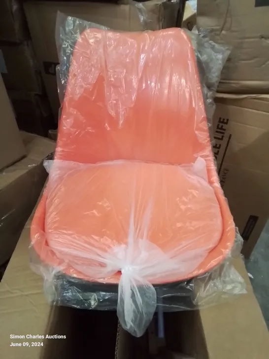 A BOXED BRIGHT ORANGE FAUX LEATHER UPHOLSTERED OFFICE DESK CHAIR/SIDE CHAIR