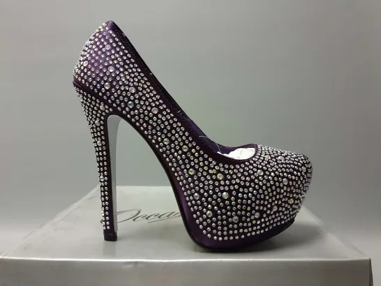 APPROXIMATELY 5 ASSORTED BOXED PAIRS OF OCCASIONS BY CASANDRA DECORATED HEELS IN PURPLE IN VARIOUS COLOURS