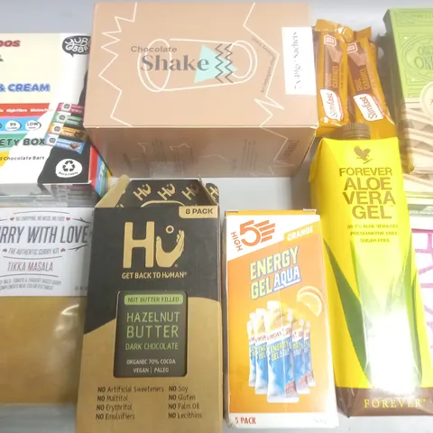 LOT OF ASSORTED FOOD ITEMS TO INCLUDE CHOCOLATE SHAKE SACHETS, HU CHOCOLATE BARS AND OLEO VERA GEL