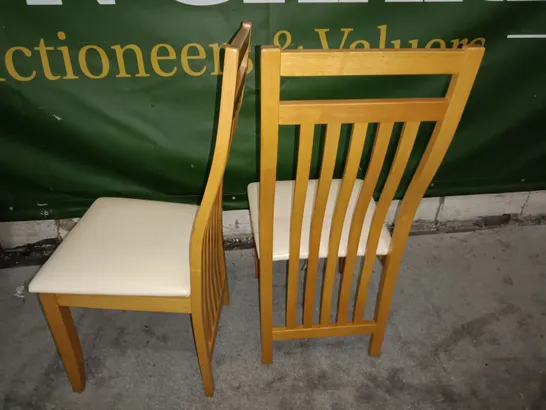 PAIR OF WOODEN SLAT BACK DINING CHAIRS WITH CREAM FAUX LEATHER SEAT PADS 