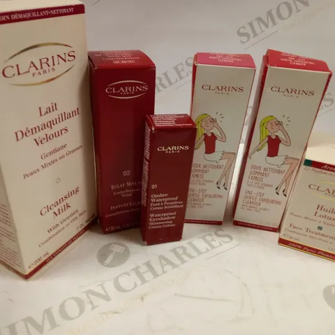 BUNDLE OF APPROX 6 CLARINS PARIS SKIN CARE AND MAKE UP ITEMS TO INCLUDE FACE TREATMENT OIL, ONE STEP GENTLE EXFOLIATING CLEANSER, CLEANSING MILK