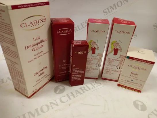 BUNDLE OF APPROX 6 CLARINS PARIS SKIN CARE AND MAKE UP ITEMS TO INCLUDE FACE TREATMENT OIL, ONE STEP GENTLE EXFOLIATING CLEANSER, CLEANSING MILK