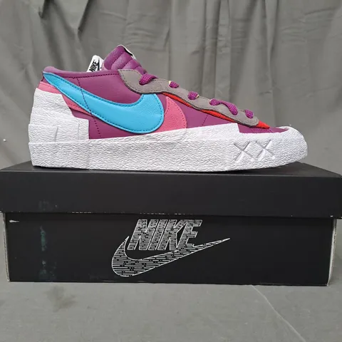 BOXED PAIR OF NIKE BLAZER LOW/SACAI/KAWS SHOES IN PURPLE/BLUE/PINK/WHITE UK SIZE 10