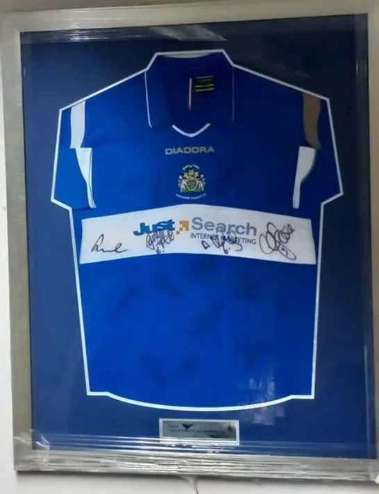 FRAMED, MOUNTED AND SIGNED STOCKPORT COUNTY FC HOME JERSEY