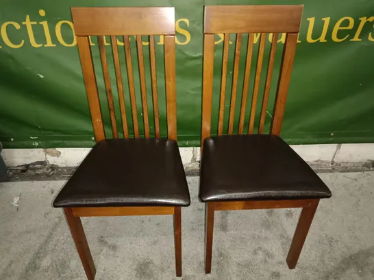 PAIR OF WOODEN SLAT BACK DINING CHAIRS WITH BLACK FAUX LEATHER SEAT PADS 