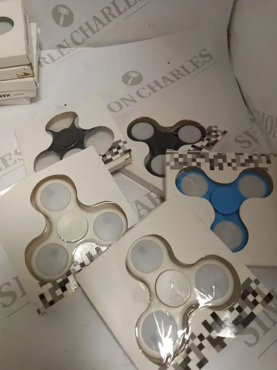 LOT OF APPROX 5 RANDOM COLOURED HAND SPINNERS