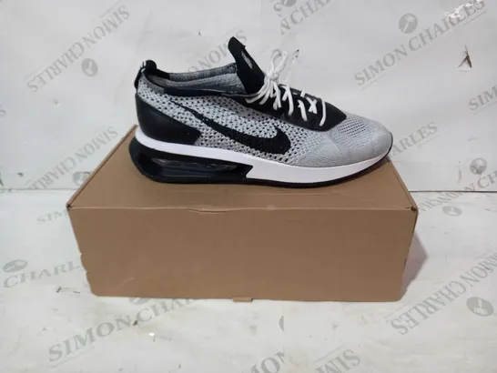 BOXED PAIR OF NIKE FLYKNIT SHOES IN WHITE/BLACK UK SIZE 7