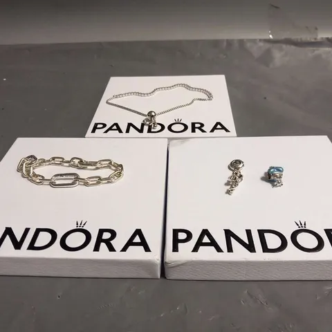 FOUR ASSORTED PANDORA PRODUCTS TO INCLUDE; BRACELTS AND CHARMS
