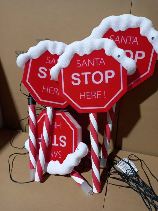 FESTIVE SET OF PRELIT SANTA STOP HERE STAKES