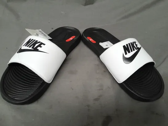 PAIR OF NIKE VICTORI ONE SLIDERS IN WHITE UK SIZE 10