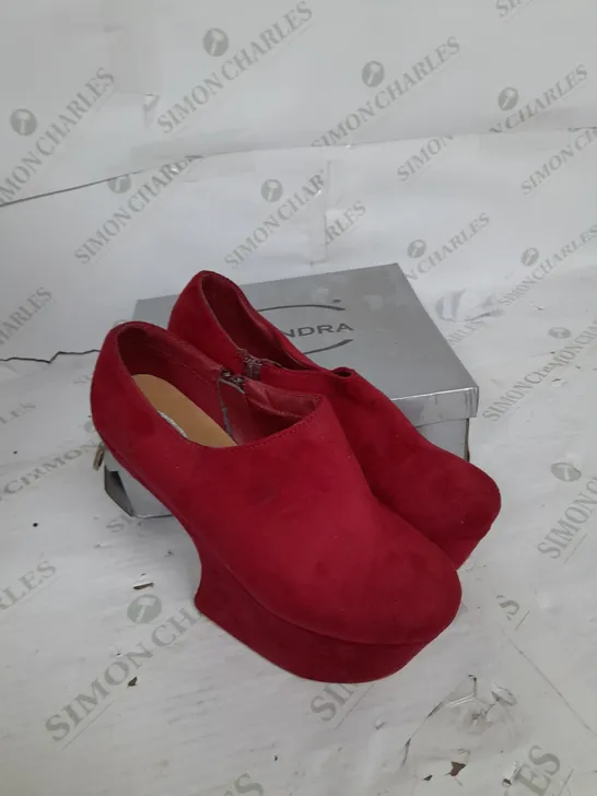 BOXED PAIR OF CASSANDRA PLATFORM SHOE IN RED SUEDE WITH GOLD SPIKES SIZE 6