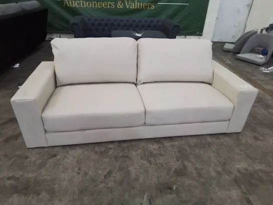 DESIGNER THREE SEATER SOFA CREAM FAUX LEATHER