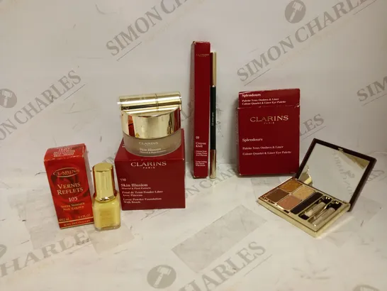 LOT OF 4 ASSORTED CLARINS PRODUCTS TO INCLUDE LOOSE POWDER FOUNDATION 13G - 110 HONEY, COLOUR QUARTET & LINER EYE PALETTE, SHEER SHIMMER NAIL COLOUR - 105 REFLECT BEIGE, ETC