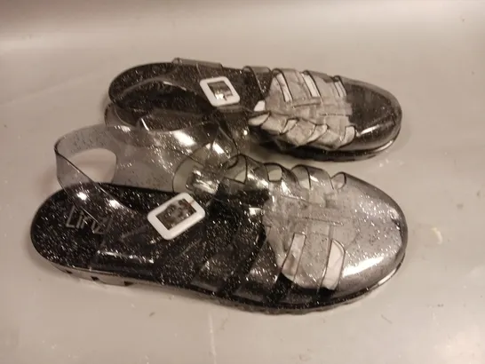 LARGE QUANTITY OF ASSORTED LINZI CLEAR GLITTER  PLASTIC SANDALS - VARIOUS SIZES