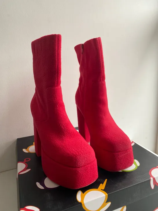 BOXED PAIR OF KOI RED HIGH HEELED BOOTS SIZE 6