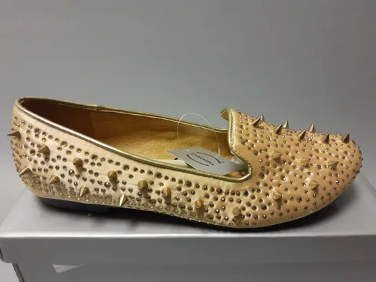 APPROXIMATELY 13 CASANDRA SPIKED SLIPONS IN CHAMPAGNE SATIN IN VARIOUS SIZES