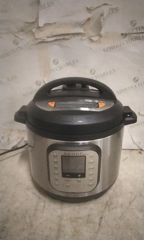 BOXED INSTANT POT  MULTI USE PRESSURE COOKER 