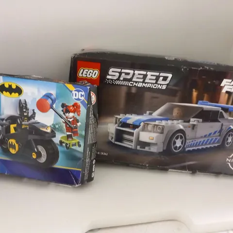 TWO ASSORTED LEGO PRODUCTS TO INCLUDE; SPEED CHAMPIONS FAST AND FURIOUS 76917 2 FAST 2 FURIOUS NISSAN SKYLINE GT-R(R34) AND 76220 BATMAN VERSUS HARLEY QUINN