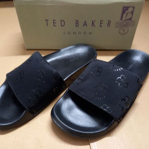 BOXED PAIR OF TED BAKER BLACK FLOWER SLIDE ONS - UK 8