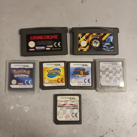 7 X ASSORTED LOOSE CARTRIDGE VIDEO GAMES TO INCLUDE POKEMON DIAMOND, MARIOKART DS, DAREDEVIL ETC 