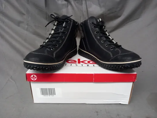 BOXED PAIR OF RIEKER WATER RESISTANT BOOTS IN BLACK SIZE 6.5