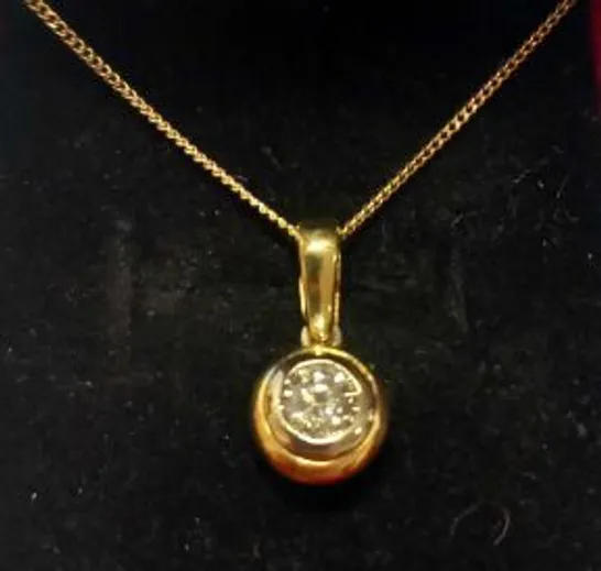 18CT GOLD DIAMOND SET PENDANT ON A CHAIN