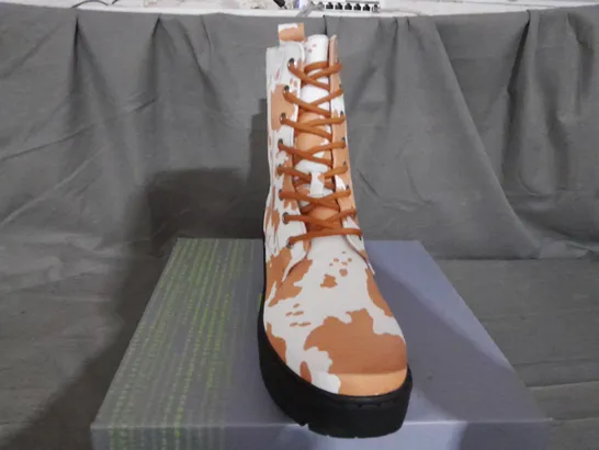 BOXED PAIR OF KOI COW PRINT BOOTS SIZE 6