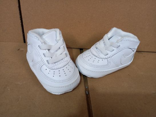 BOXED PAIR OF DESIGNER BABY SHOES IN THE STYLE OF NIKE IN WHITE