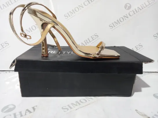 BOXED PAIR OF PRETTY LITTLE THING OPEN TOE STRAPPY HIGH HEEL SANDALS IN METALLIC GOLD SIZE 5