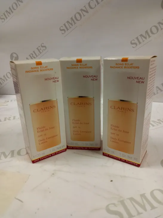 LOT OF APPROX 12 CLARINS PARIS DAILY ENERGIZER LOTION SPF 15 12 X 30ML