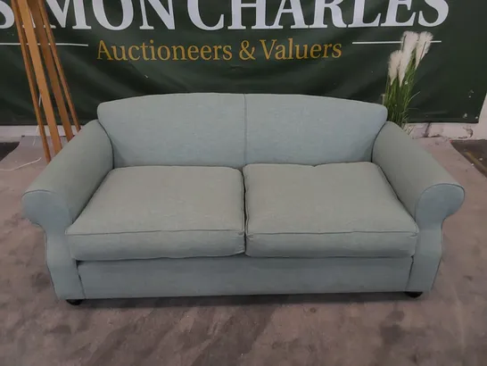 THE CHILMARK 3-SEATER SOFA UPHOLSTERED IN AQUA FABRIC