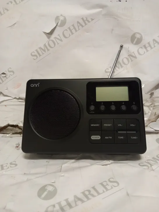 ON PORTABLE AM/FM RADIO