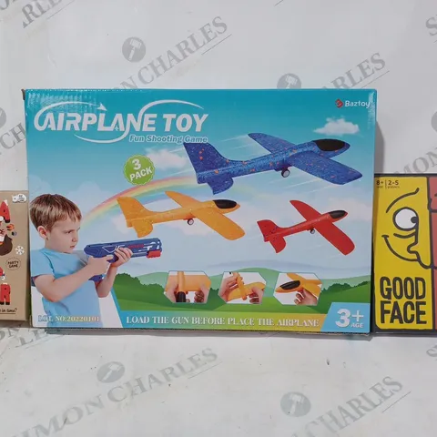 BOX OF APPROXIMATELY 20 ASSORTED TOYS AND GAMES TO INCLUDE GOOD FACE BAD FACE, AIRPLANE TOY SHOOTING GAME, SANTA BANTER, ETC