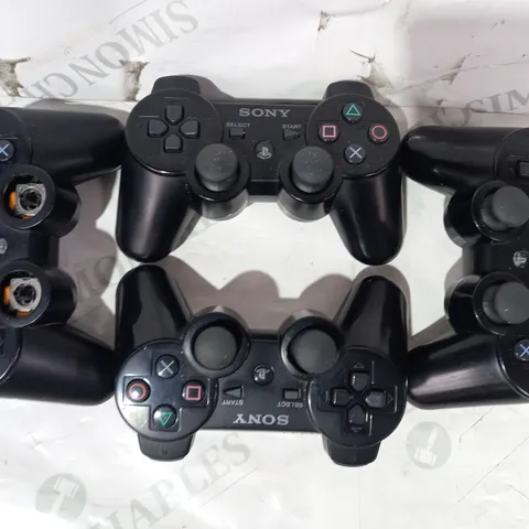 LOT OF 4 ASSORTED SONY PLAYSTATION CONTROLLERS