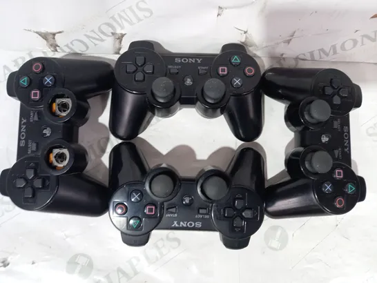 LOT OF 4 ASSORTED SONY PLAYSTATION CONTROLLERS