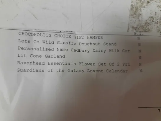 APPROXIMATELY 7 ASSORTED PRODUCTS TO INCLUDE; CHOCOHOLICS CHOICE GIFT HAMPER, LETS GO WILD GIRAFFE DOUGHNUT STAND, CADBURYS DAIR MILK CAR, LIT CONE GARLAND, RAVENHEAD ESSENTIALS FLOWER SET OF 2 AND GU RRP £163
