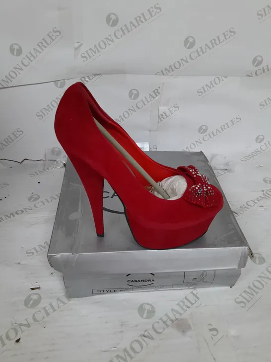 BOXED PAIR OF CASANDRA PLATFORM STILLETO HEEL IN RED SUEDE WITH RHINESTONE BOW DETAIL SIZE 5