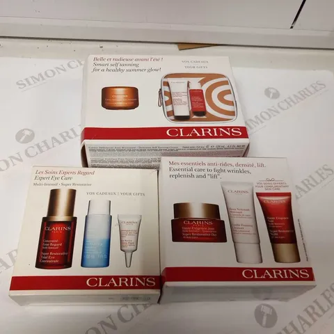 3 ASSORTED CLARINS PARIS PRODUCTS TO INCLUDE; EXPERT EYE CAR, ESSENTIAL CARE TO FIGHT WRINKLES REPLENISH AND LIFT AND SMART TANNING FOR A HEALTHIER GLOW