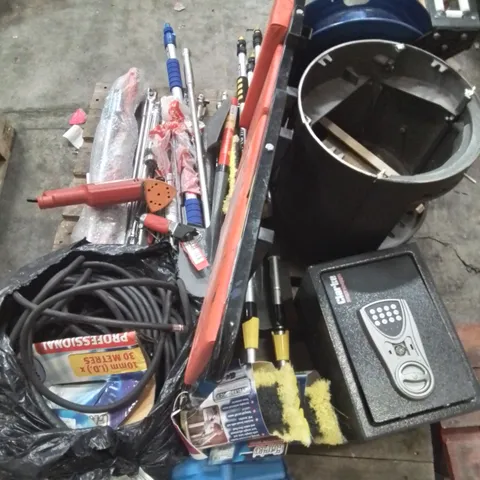 PALLET CONTAINING VARIOUS BROKEN/INCOMPLETE TOOLS TO INCLUDE: AIR HOSES, WHEEL NUT BREAKER BARS, SAFE, CAST IRON STOVE ETC.