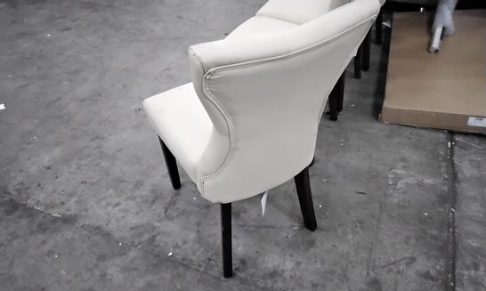 DESIGNER SET OF 4 CREAM FAUX LEATHER CHAIRS WITH SHAPED BACKS AND DARK WOOD LEGS