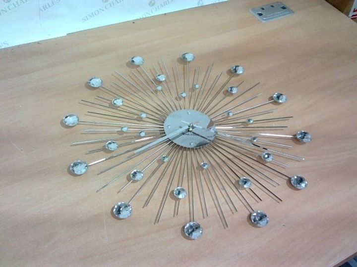 Lot 10603 KARLSSON SUNBURST WALL CLOCK SILVER Simon Charles Auctioneers