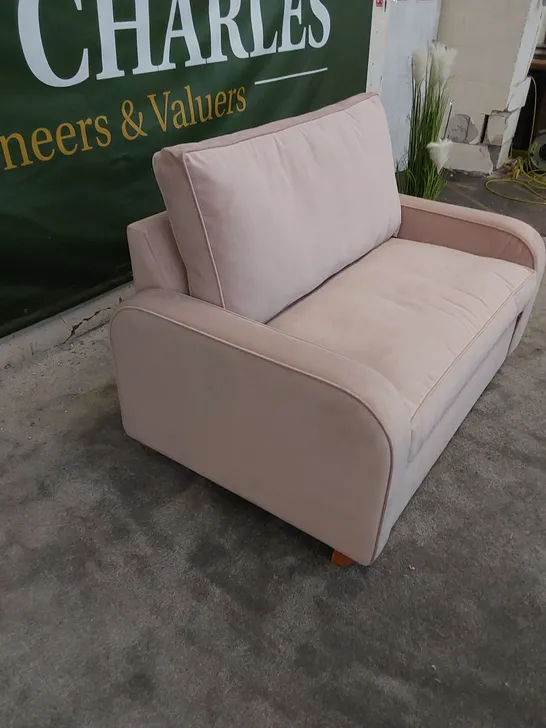 THE DUNSMORE LOVE SEAT SOFA BED UPHOLSTERED IN PETAL PINK FABRIC 