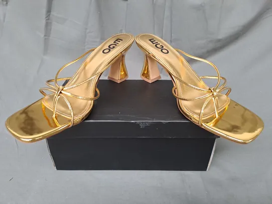 BOXED PAIR OF EGO TOE-POST HEELED SANDALS IN METALLIC GOLD UK SIZE 8