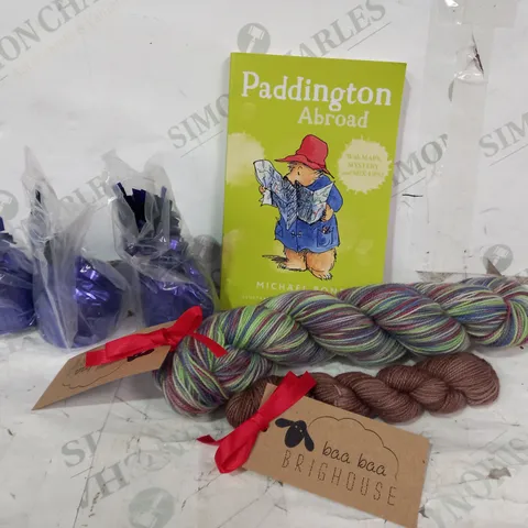 BOX OF APPROXIMATELY 10 ASSORTED HOUSEHOLD ITEMS TO INLCLUDE FOIL BALLOON WEIGHTS IN PURPLE, PADDINGTON ABROAD BOOK, BAA BAA BRIGHTHOUSE YARN, ETC