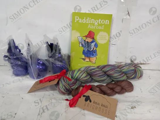 BOX OF APPROXIMATELY 10 ASSORTED HOUSEHOLD ITEMS TO INLCLUDE FOIL BALLOON WEIGHTS IN PURPLE, PADDINGTON ABROAD BOOK, BAA BAA BRIGHTHOUSE YARN, ETC