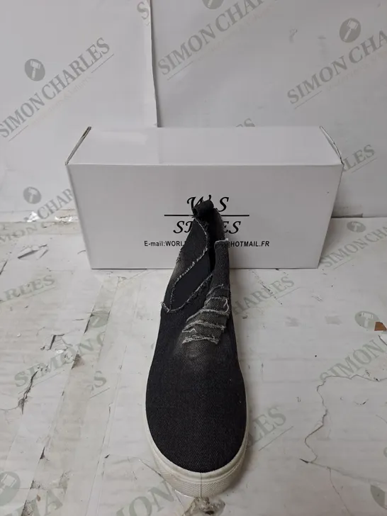  APPROXIMATELY 10 PAIRS OF BOXED W.S SLIP ON BLACK DISTRESSED FLAT TRAINERS IN VARIOUS SIZES