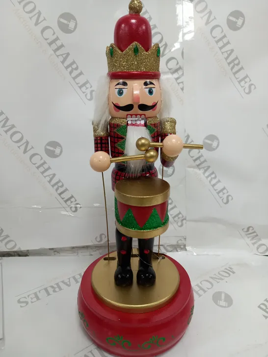 FESTIVE 32CM WOODEN ANIMATED MUSICAL NUTCRACKER